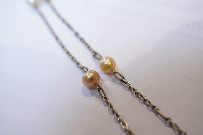An Art Deco sapphire, natural pearl and diamond necklace, circa 1920